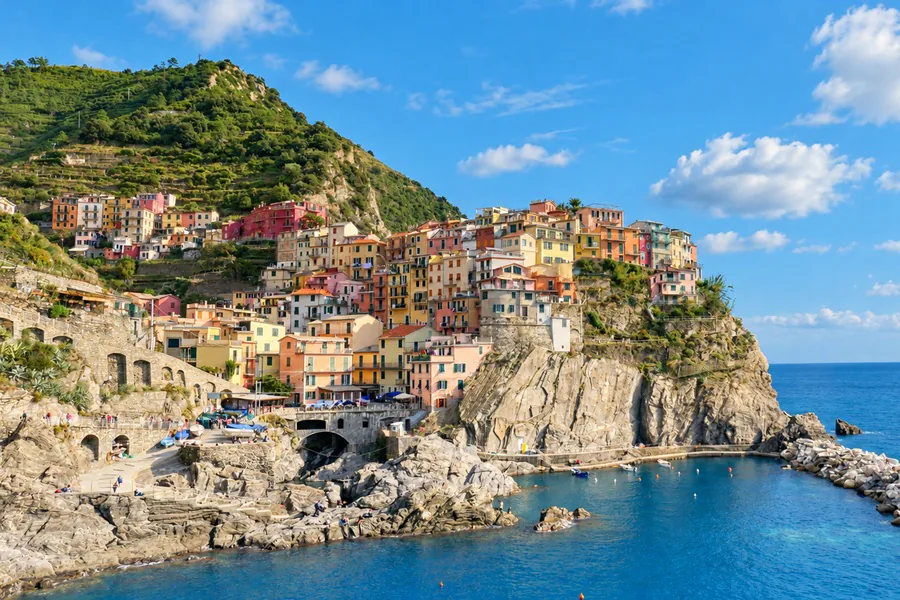 Manarola and its colorful houses perched on the rock above the sea and its small harbor
