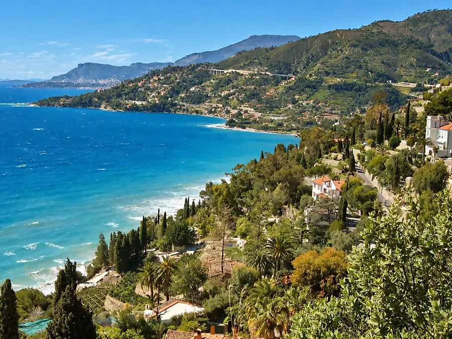 The Italian Riviera coastline, its villas and cypresses above a blue sea