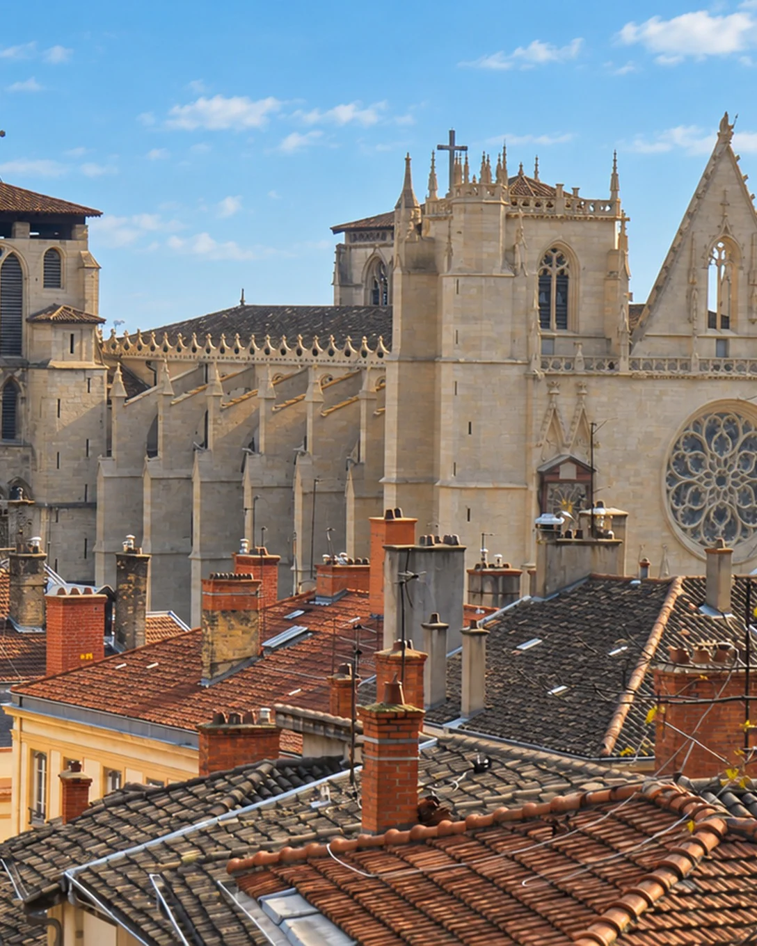 Saint-Jean Cathedral and the rooftops of Vieux Lyon, a Ferris wheel on the horizon