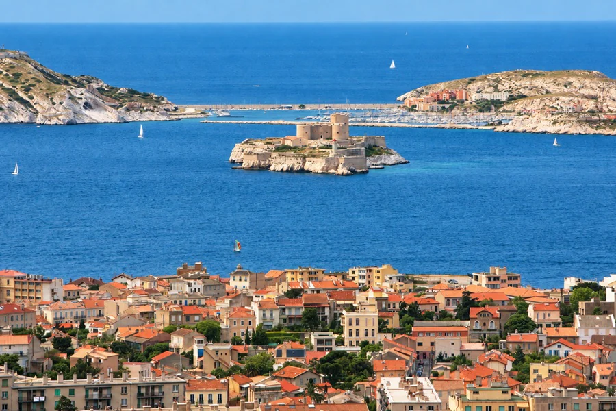 The Château d’If on its islet, facing the Frioul islands, above the rooftops of Marseille