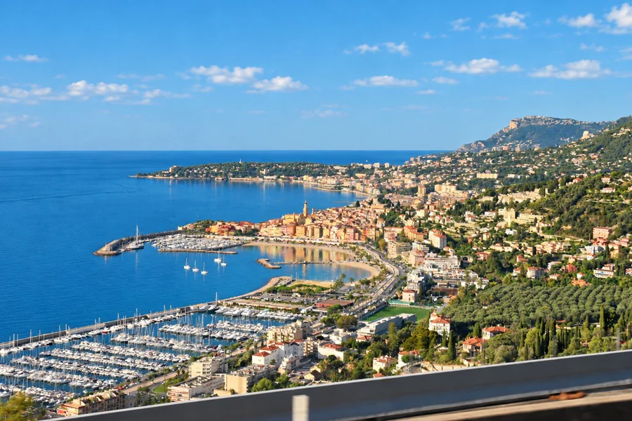 Menton seen from the heights, the Garavan harbor, the old town and the bay out to Cap Martin