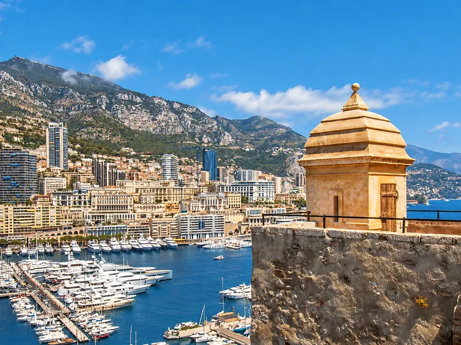 Port Hercules and the buildings of Monte Carlo seen from the ramparts of the Rock, a stone sentry box in the foreground