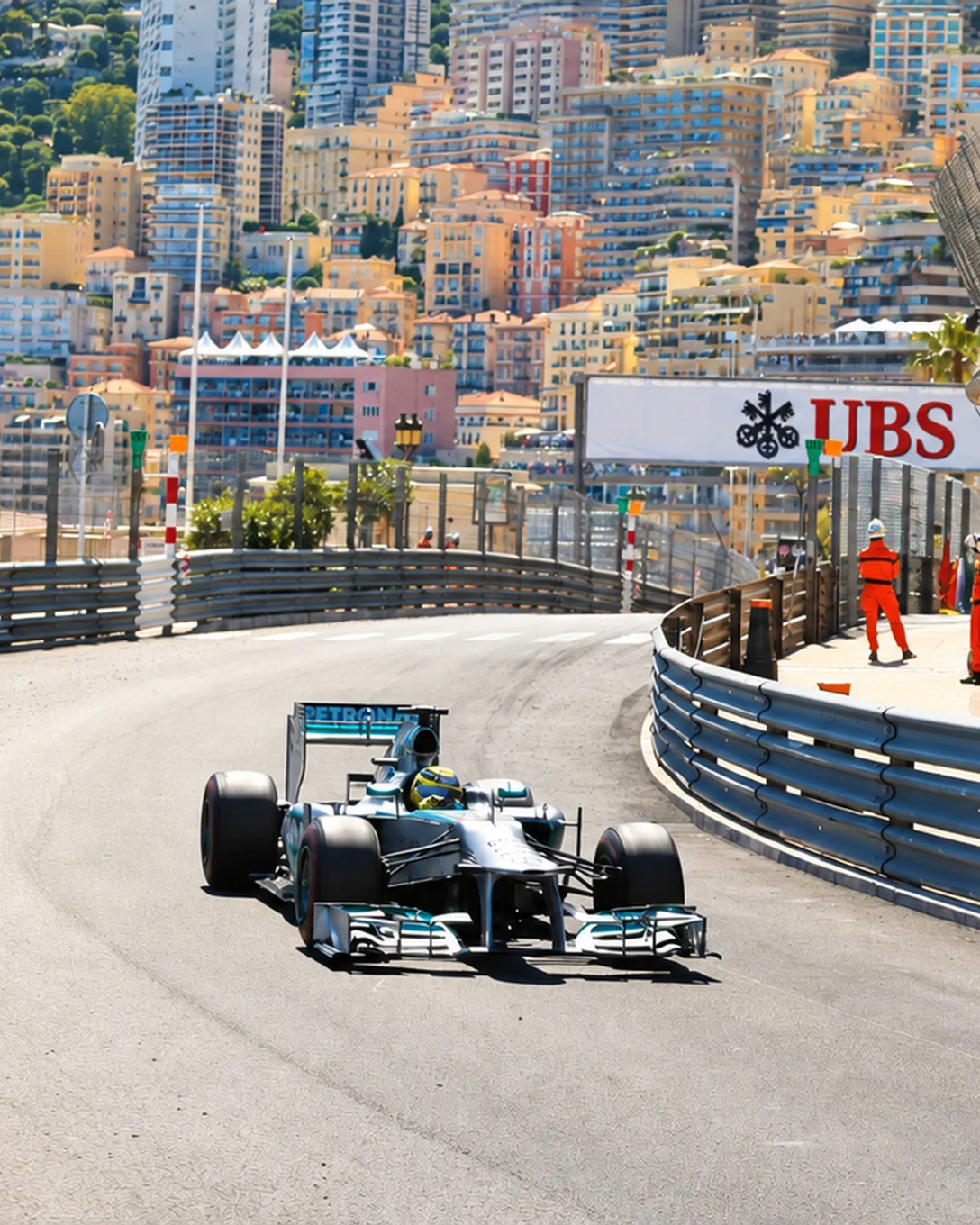 A Formula 1 car in the streets of Monaco, alongside the grandstands
