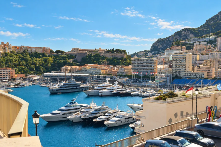 Yachts moored in Port Hercule in Monaco, between the Rock and the buildings of Monte Carlo