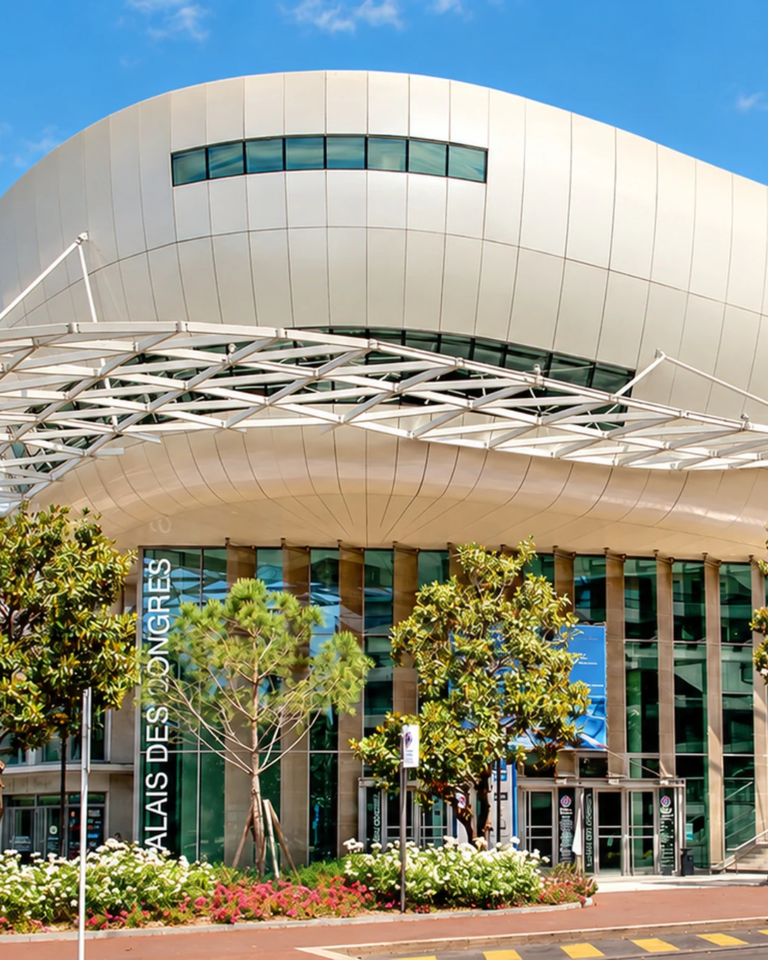 Antipolis, the Palais des Congrès of Antibes Juan-les-Pins, with its white dome and glass walls among pines and magnolias