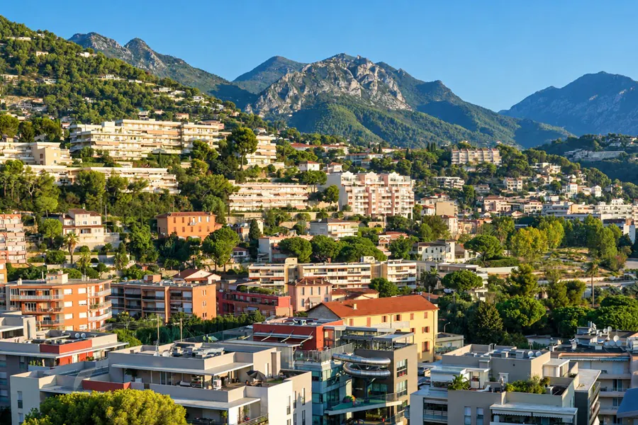 Roquebrune-Cap-Martin at the foot of the mountains, its houses and apartment buildings among the pines